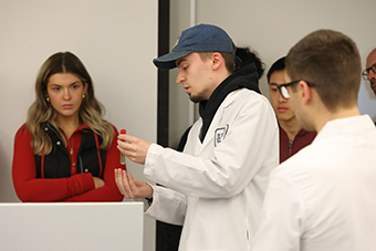 Student demonstrating in lab