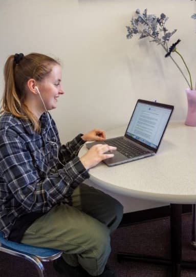 person learning on laptop