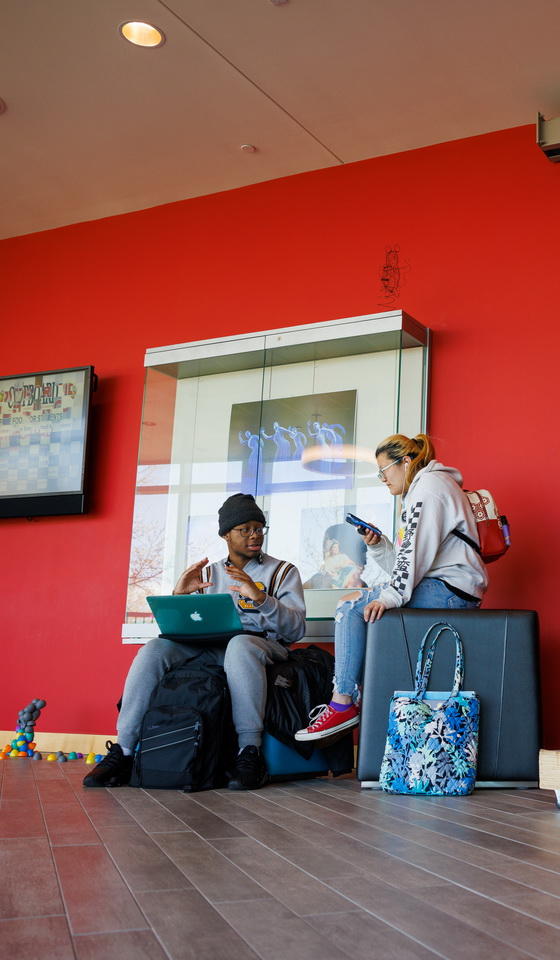 Students sitting on the floor in the FAIC