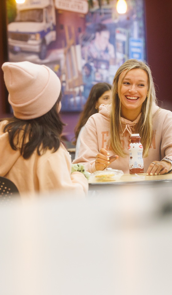 students talking around a table