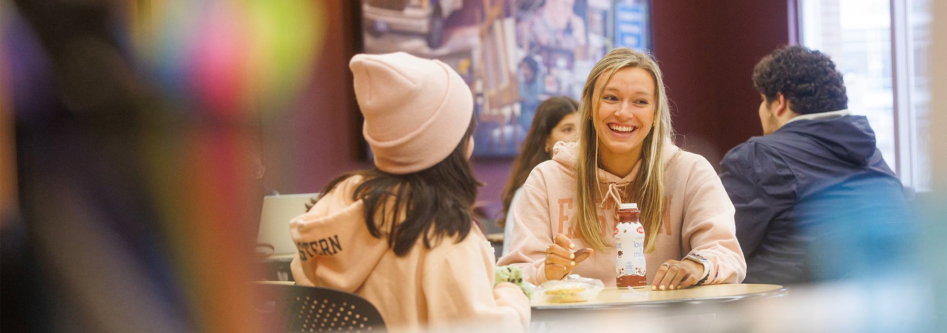 students talking around a table