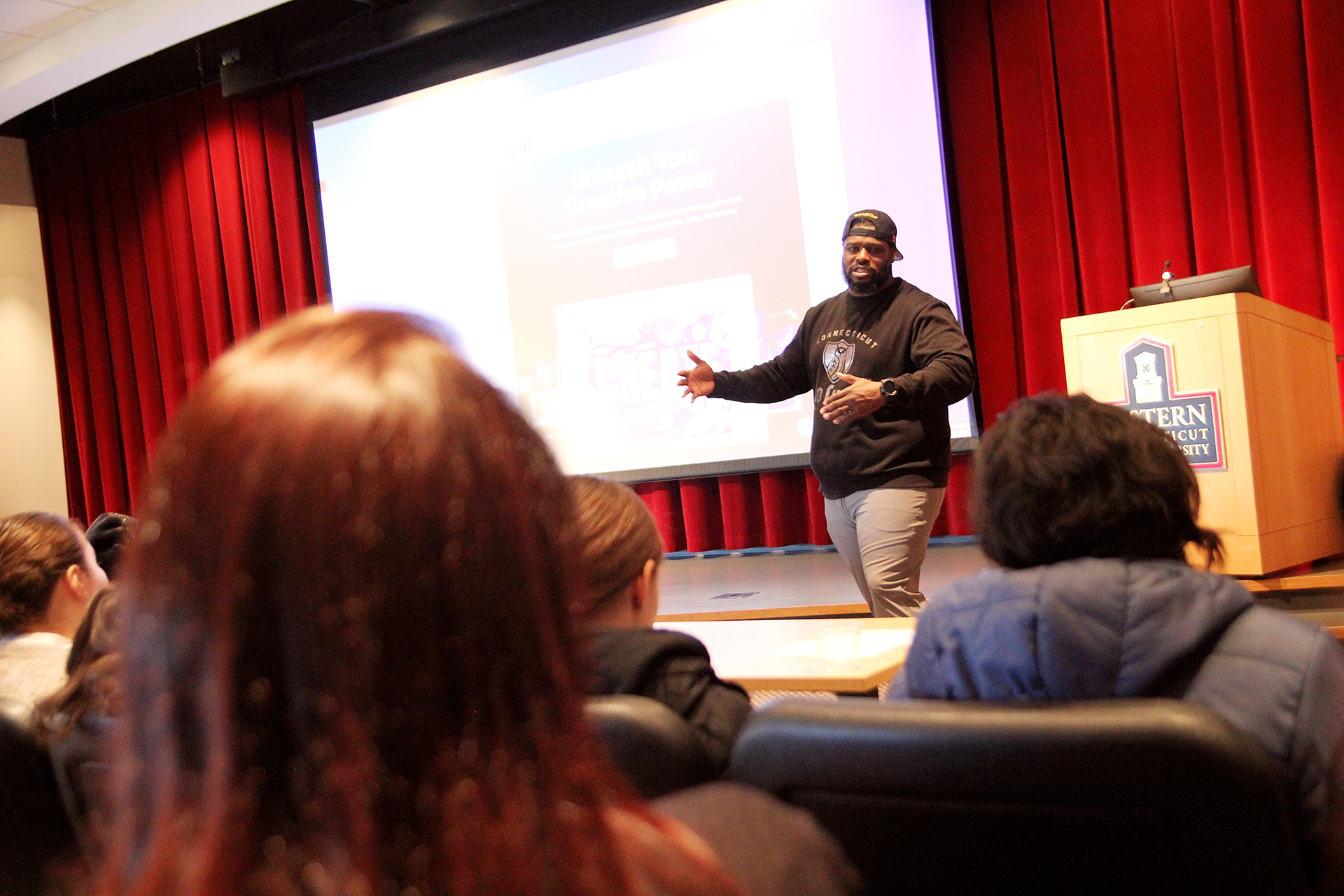 man lecturing to a crowd