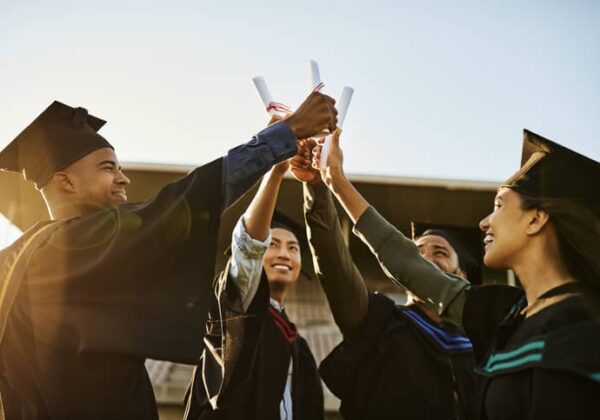 group of graduates celebrating their achievement.