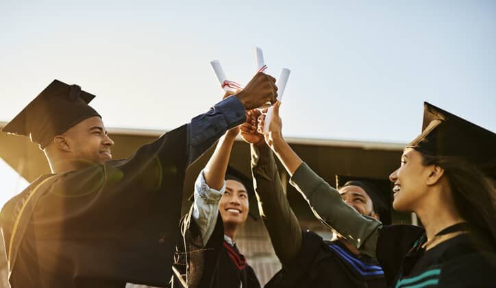 group of graduates celebrating their achievement.