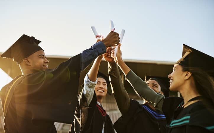 group of graduates celebrating their achievement.