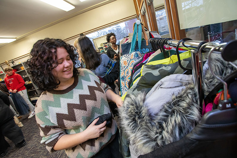 A student browses used goods at the Thrift Warriors shop.