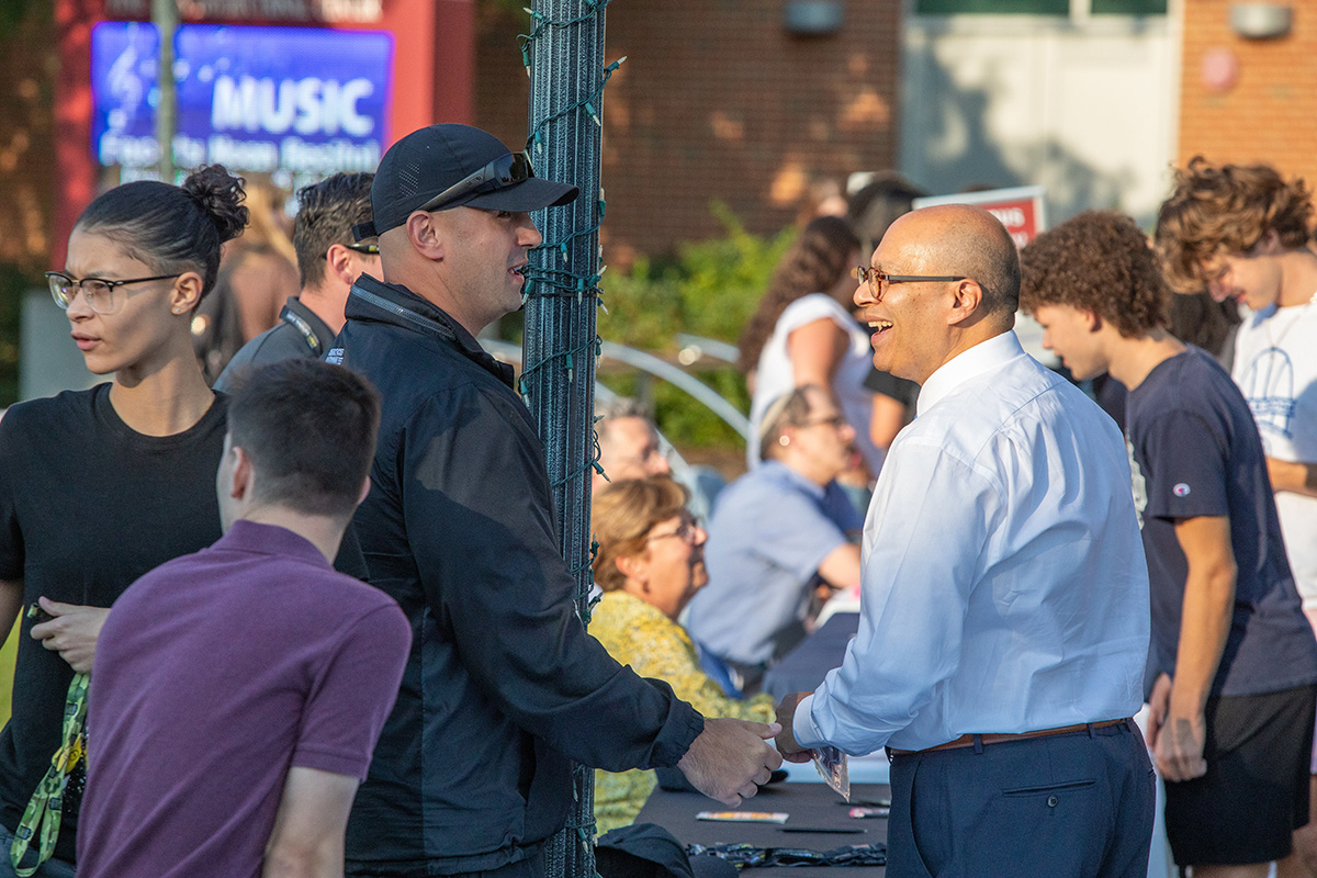 President Ismaili talking with people