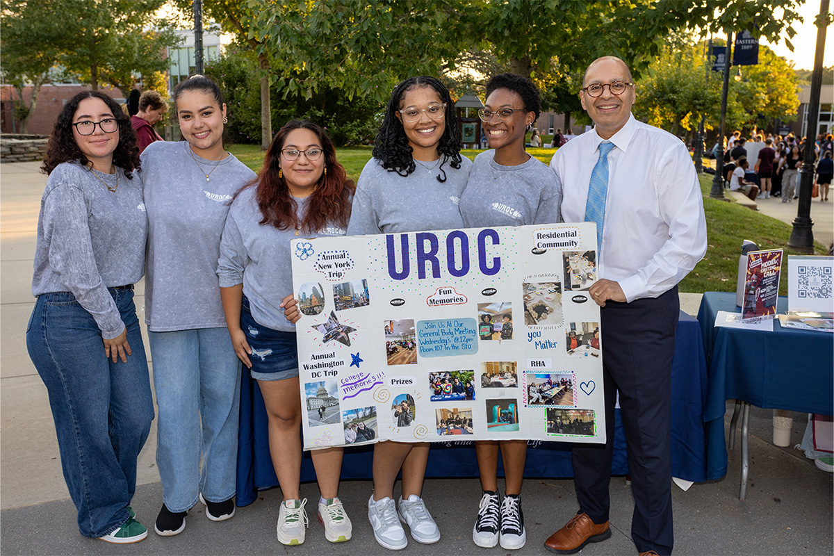 President Ismaili and students from UROC posing for photo