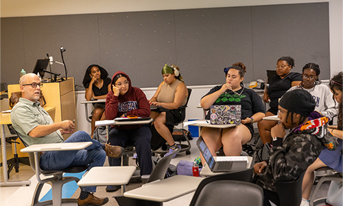 Professor talking to students